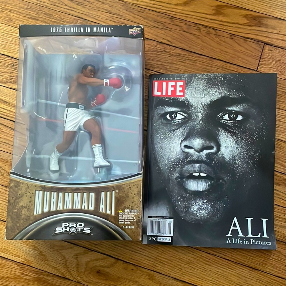 Collectible Muhammad Ali figurine with Time magazine.